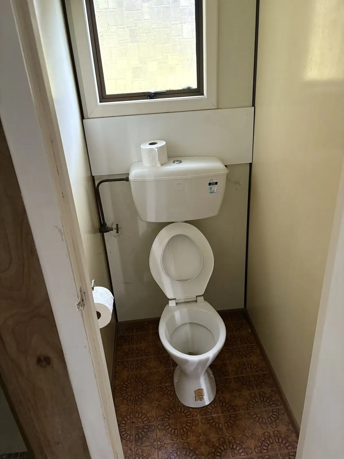 Older toilet suite before replacement